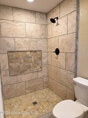 a bathroom with a bathtub and toilet