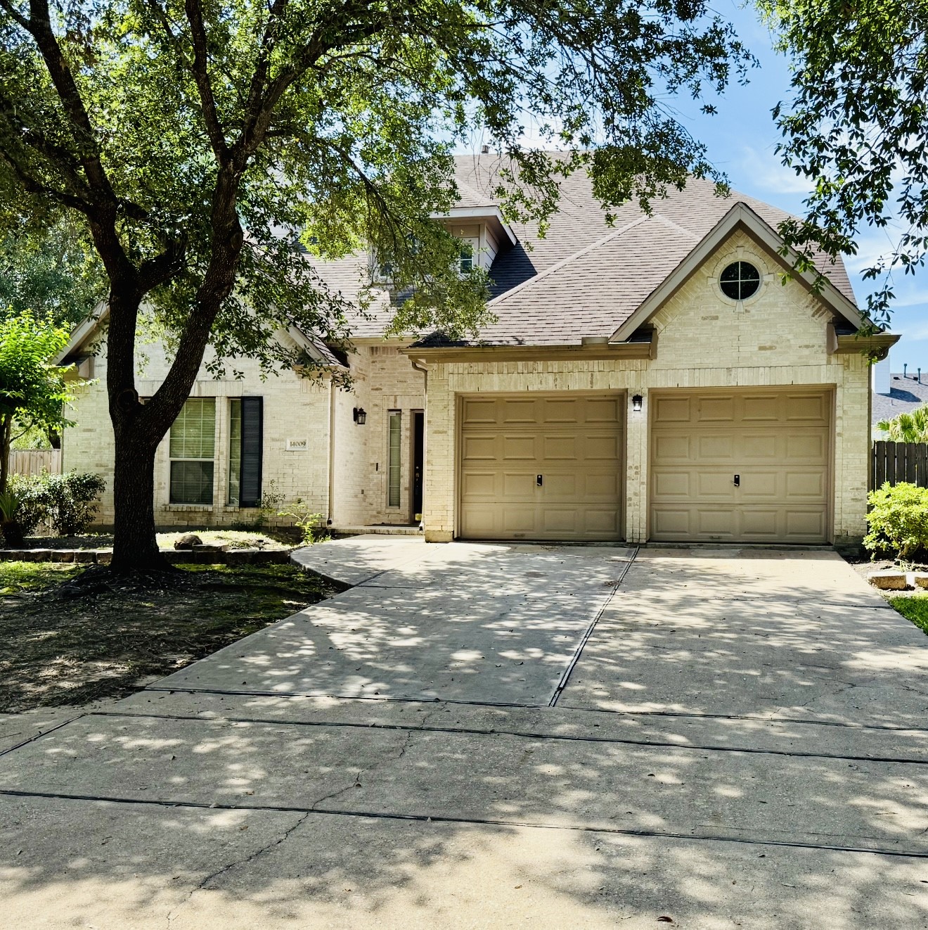 14009 Hollow Canyon Lane Rosharon, TX 77583 - Photo 2 of 20 a front view of a house with a yard and garage