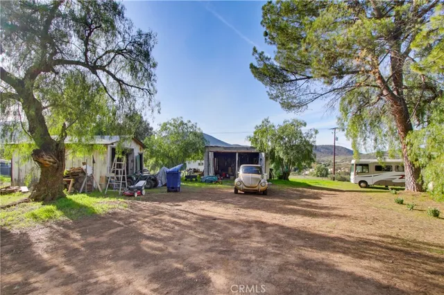 a view of a street with cars on the road