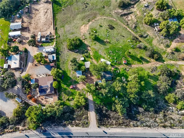 an aerial view of residential house with outdoor space
