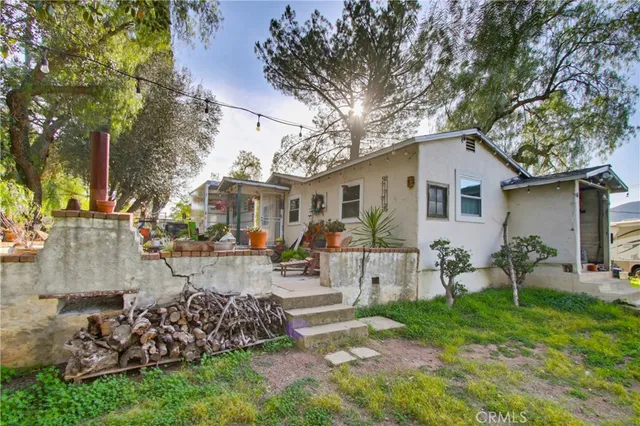 a front view of house with yard and outdoor seating