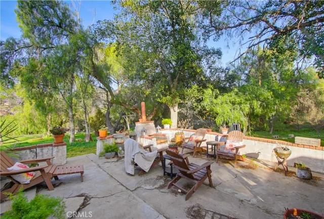 a view of a backyard with sitting area