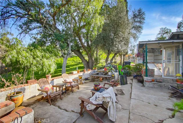 a view of a tables and chairs in a patio