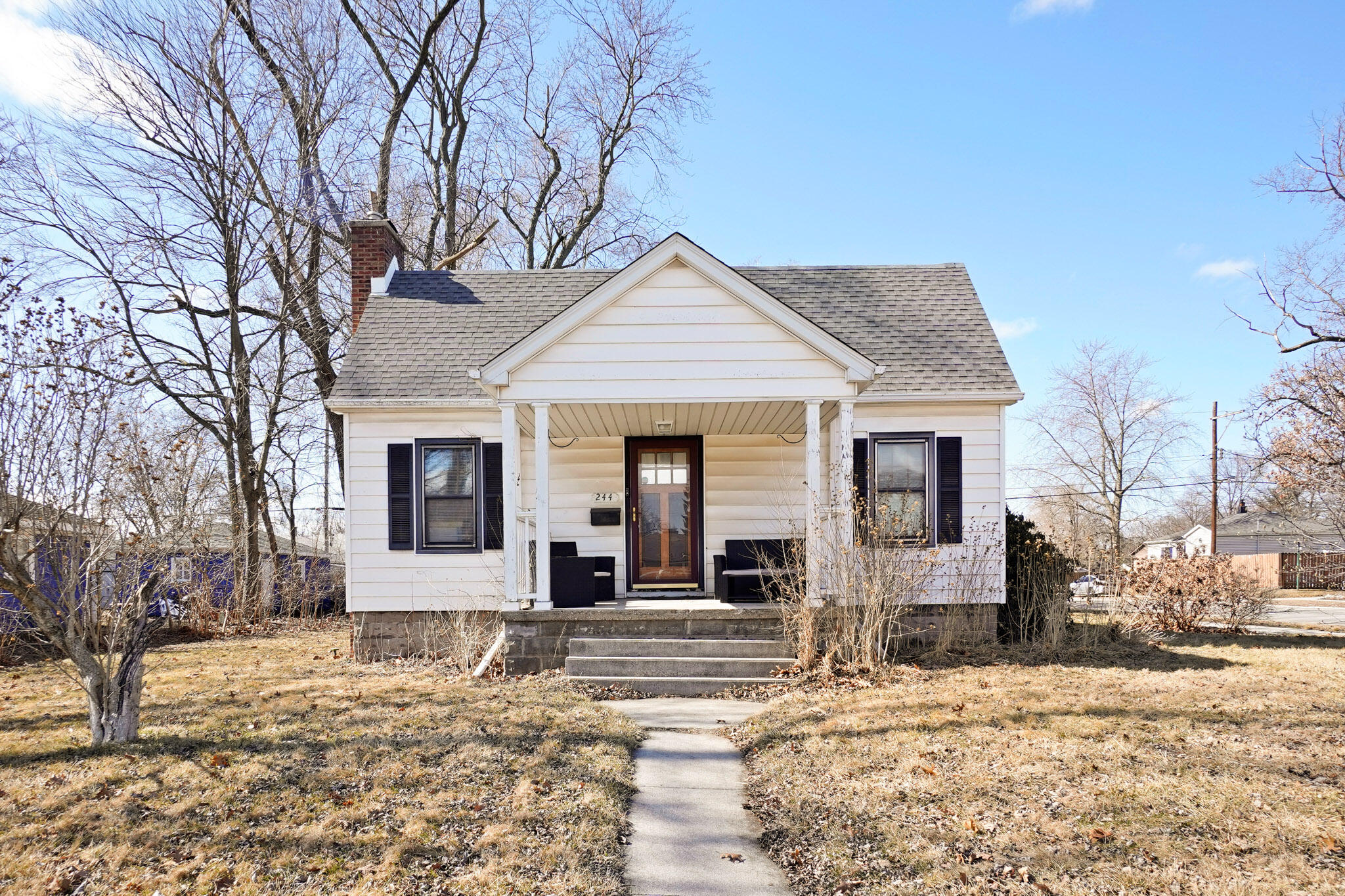 244 Dwiggins Griffith, IN 46319 - Photo 1 of 15 a front view of a house with a yard