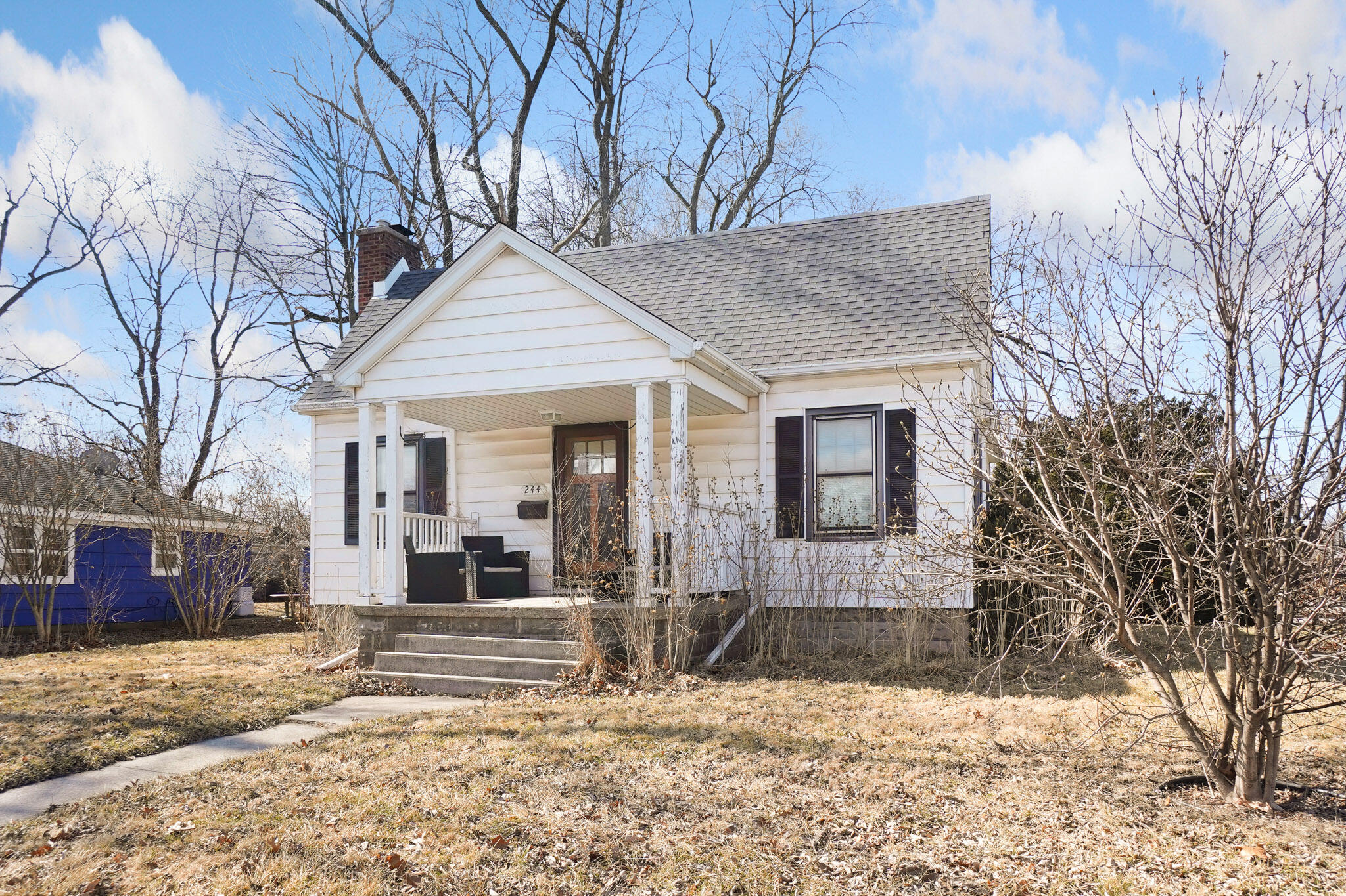 244 Dwiggins Griffith, IN 46319 - Photo 2 of 15 a view of a house with snow on the road