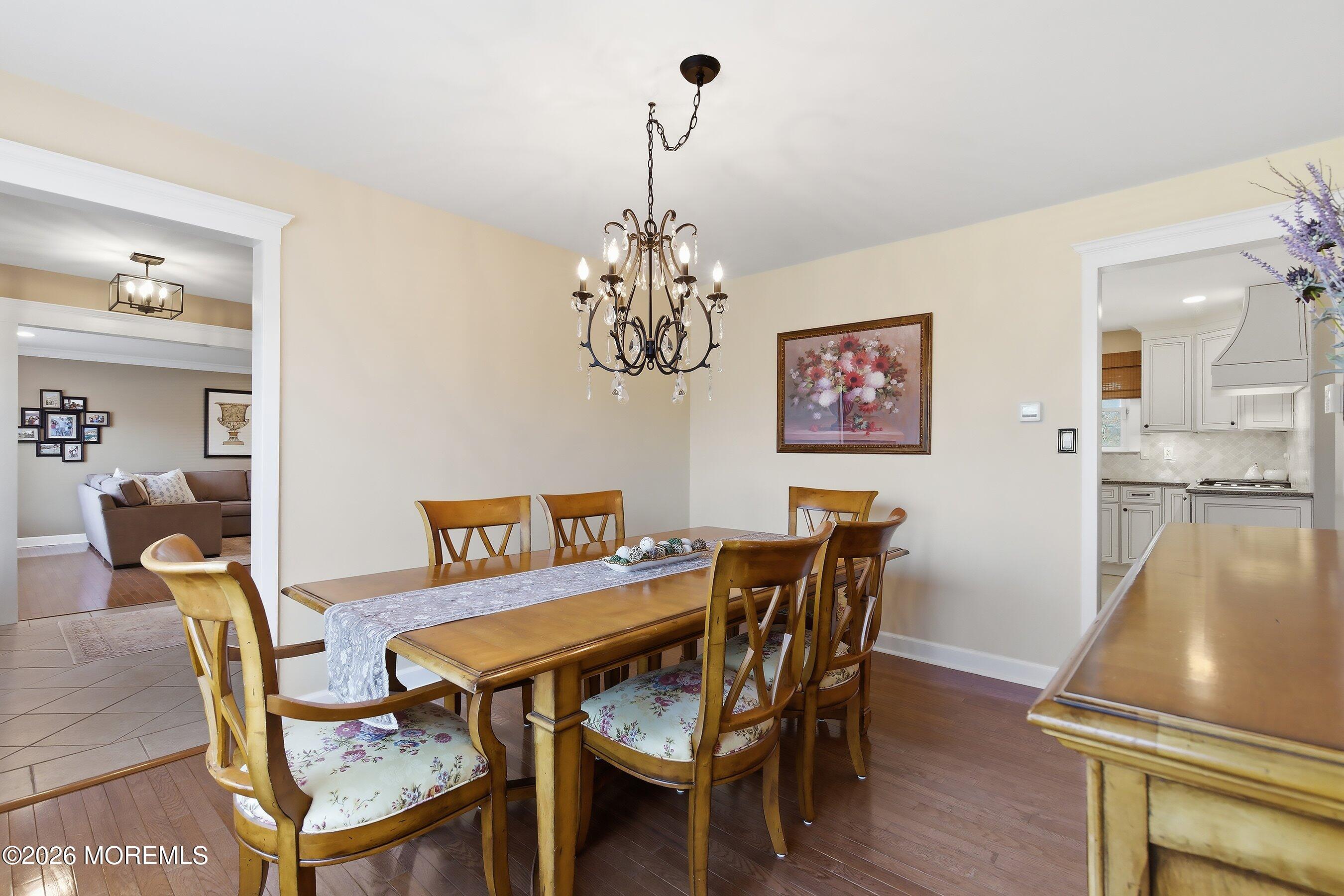 23 Paulette Lane Howell, NJ 07731 - Photo 20 of 35 a view of a dining room with furniture and chandelier