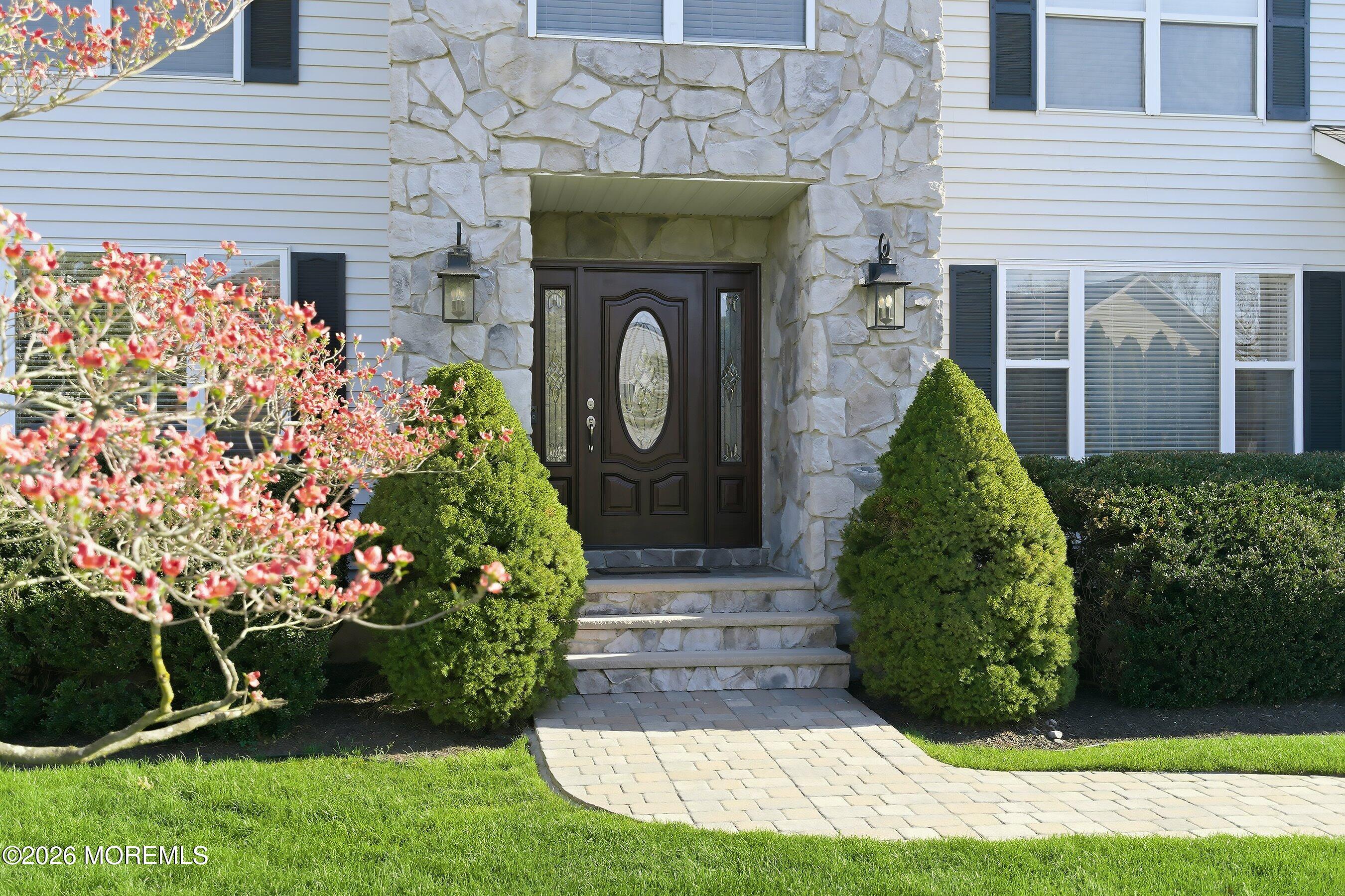 23 Paulette Lane Howell, NJ 07731 - Photo 2 of 35 a front view of a house with a garden