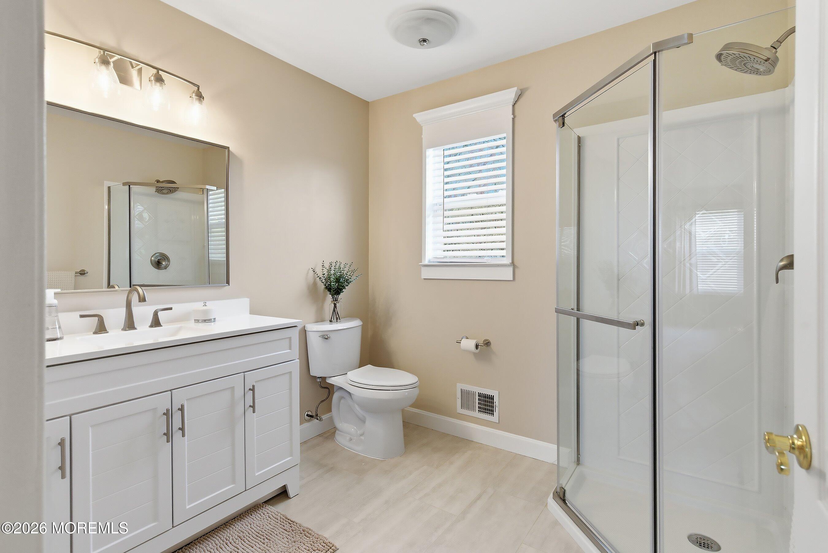 23 Paulette Lane Howell, NJ 07731 - Photo 25 of 35 a bathroom with a double vanity sink toilet and shower