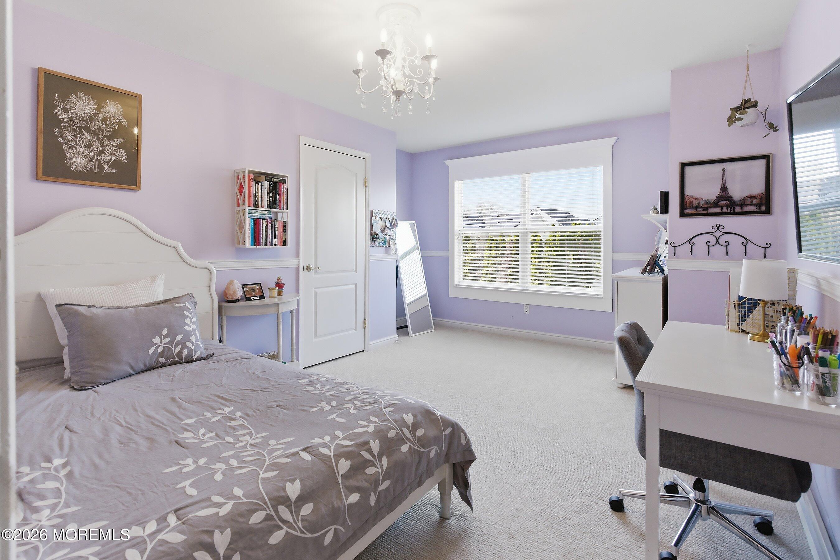 23 Paulette Lane Howell, NJ 07731 - Photo 26 of 35 a bedroom with a bed and a chair