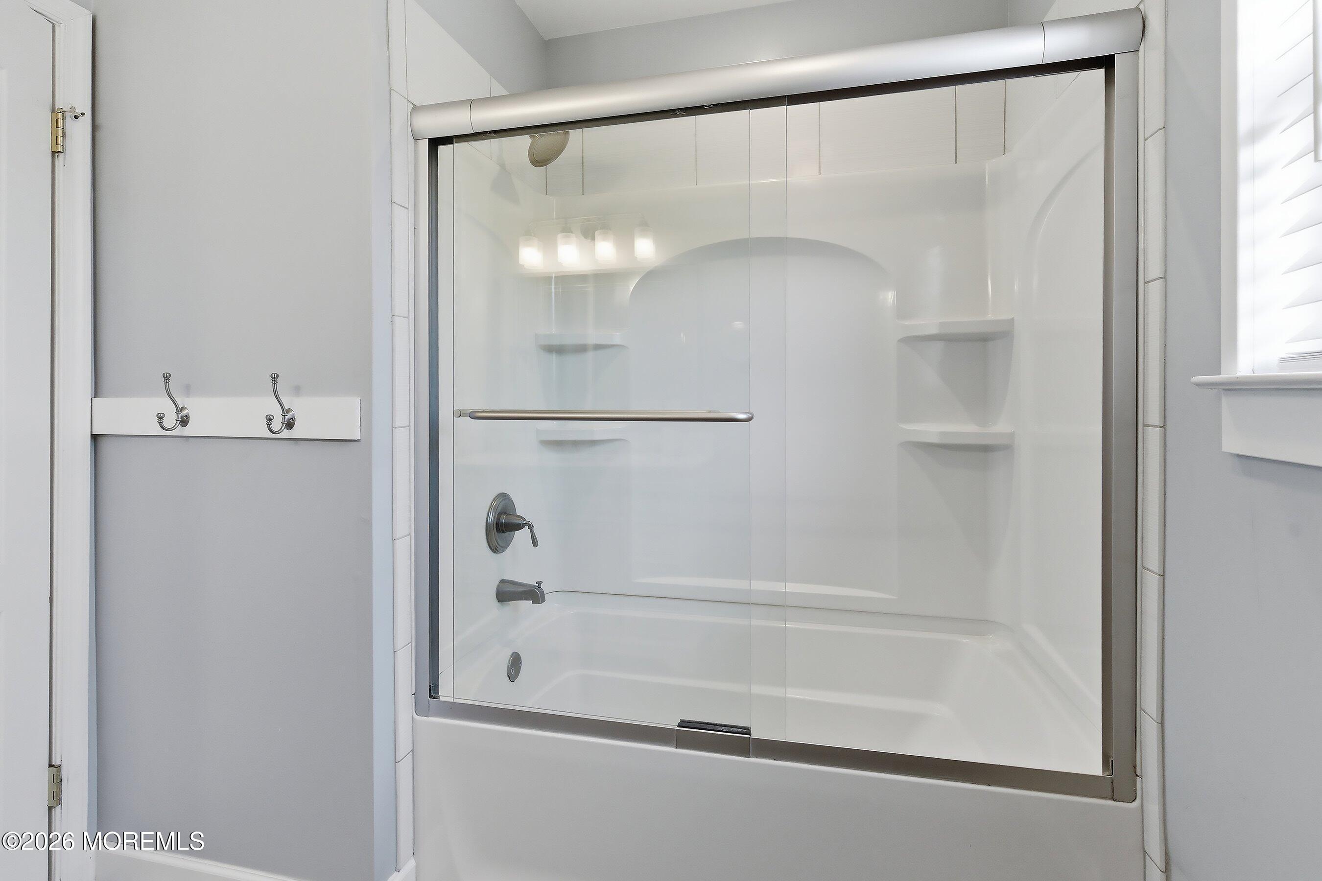 23 Paulette Lane Howell, NJ 07731 - Photo 30 of 35 a bathroom with a glass shower door