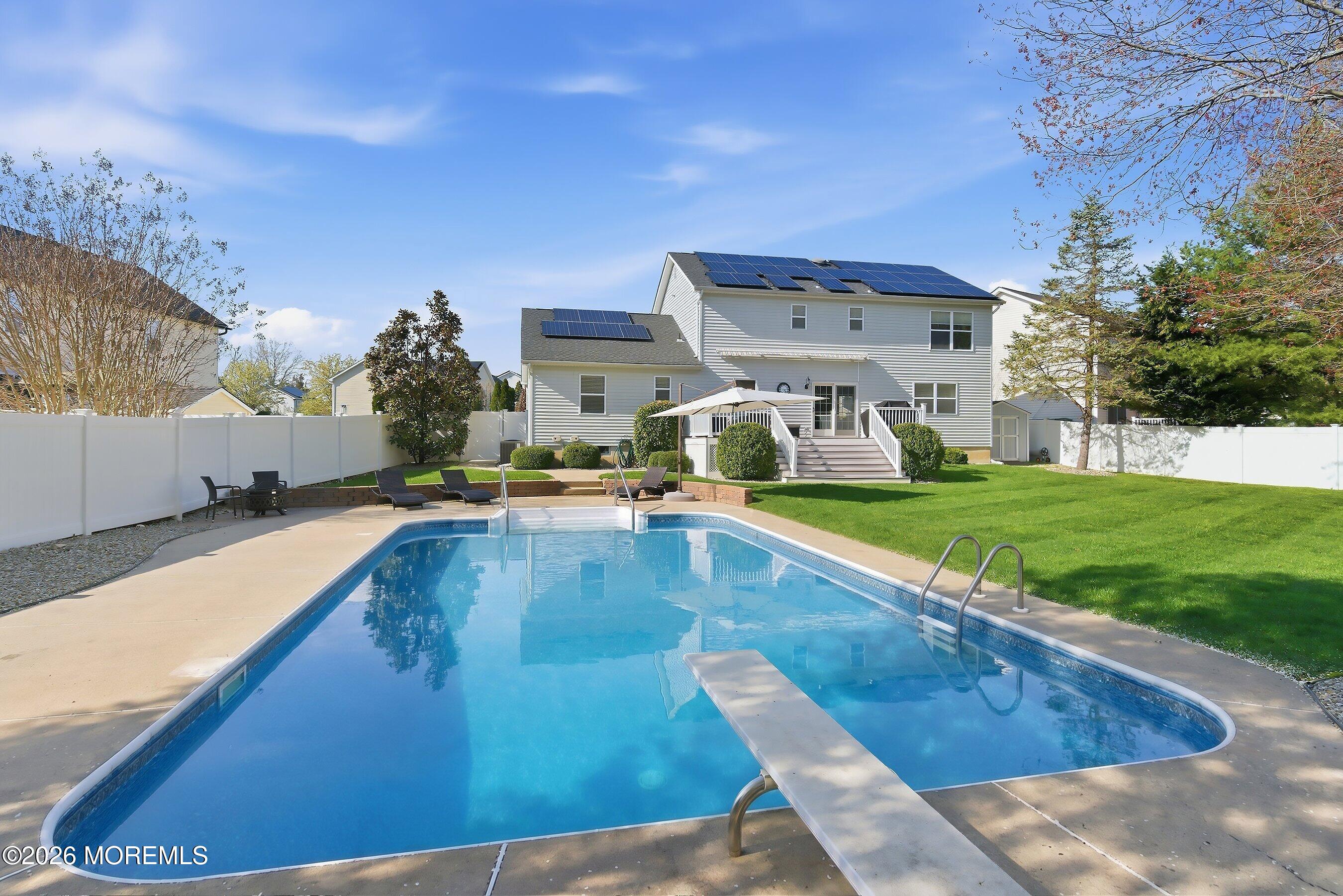 23 Paulette Lane Howell, NJ 07731 - Photo 3 of 35 a view of a swimming pool with a yard