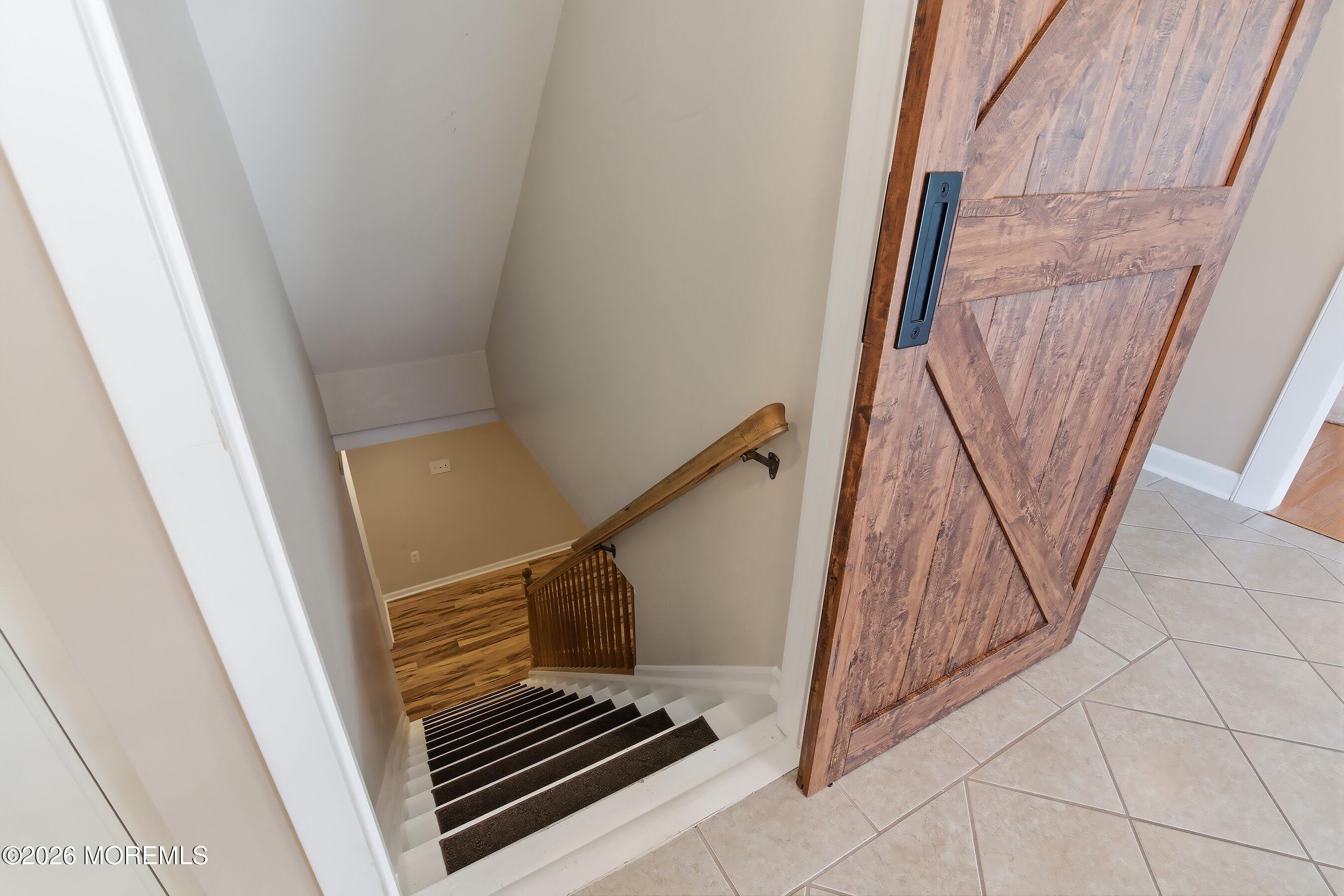 23 Paulette Lane Howell, NJ 07731 - Photo 31 of 35 a view of staircase with white walls and railing