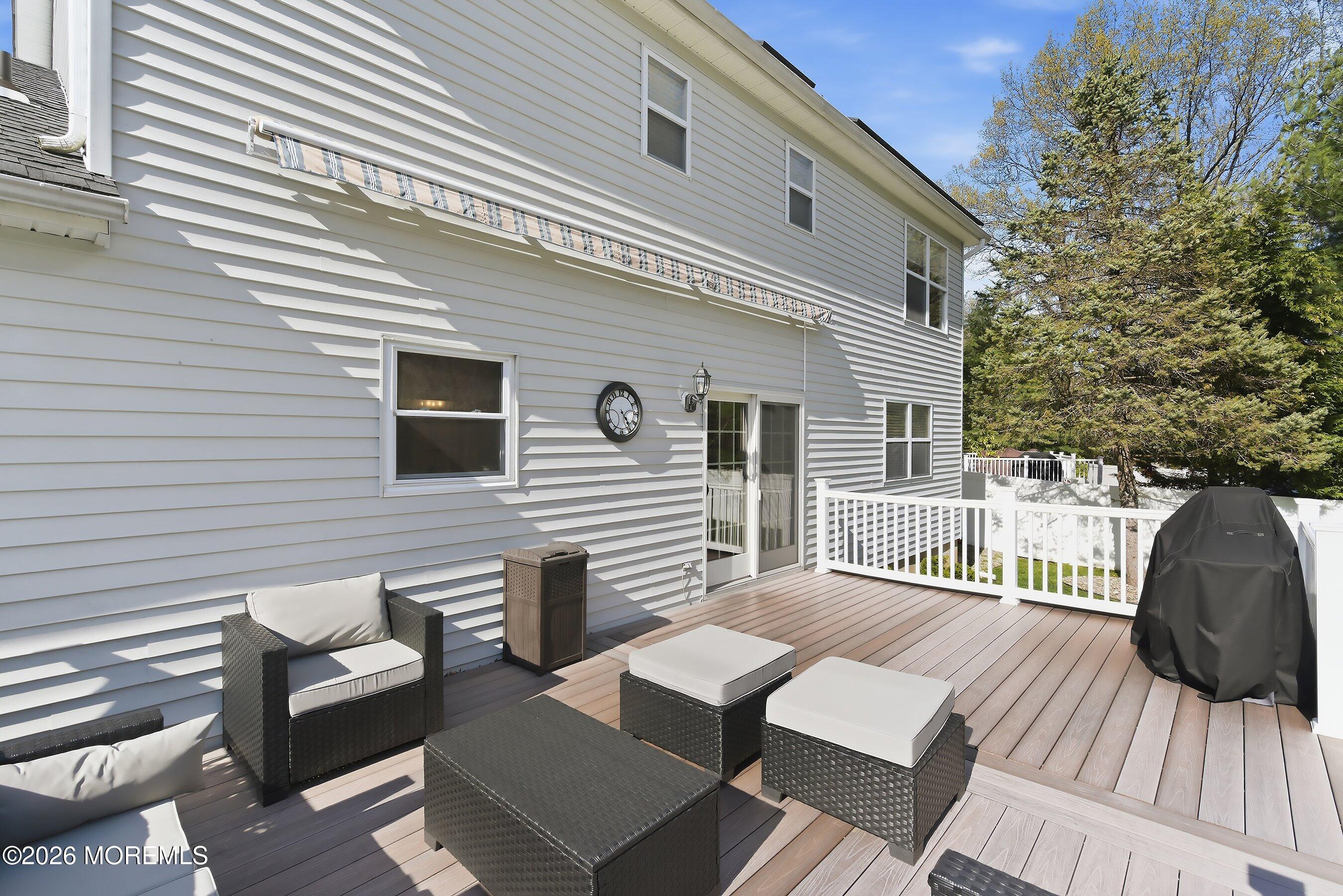 23 Paulette Lane Howell, NJ 07731 - Photo 9 of 35 a view of a patio with a table and chairs