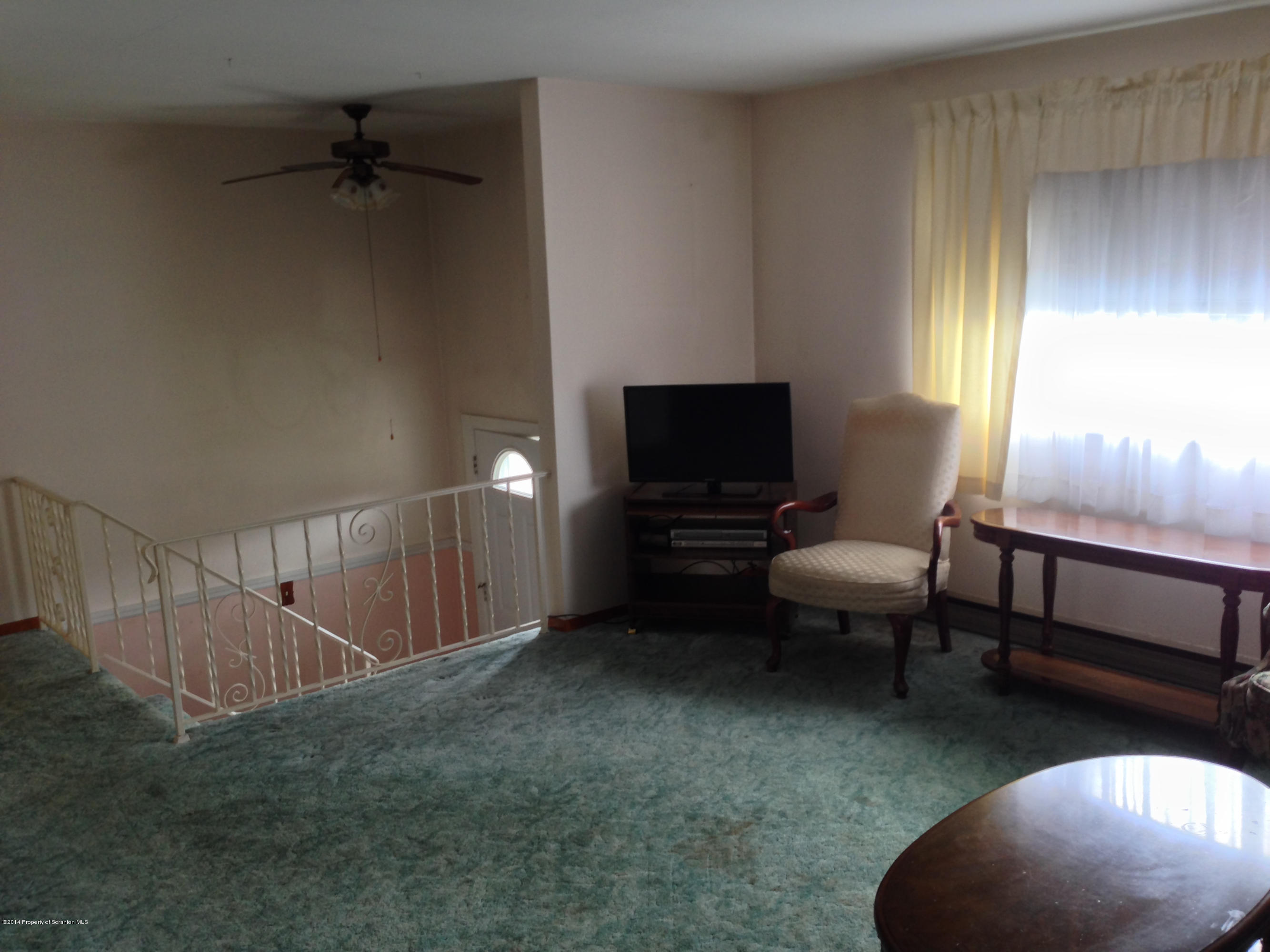 810 Lions Road Lake Ariel, PA 18436 - Photo 13 of 33 a living room with furniture a rug and a window