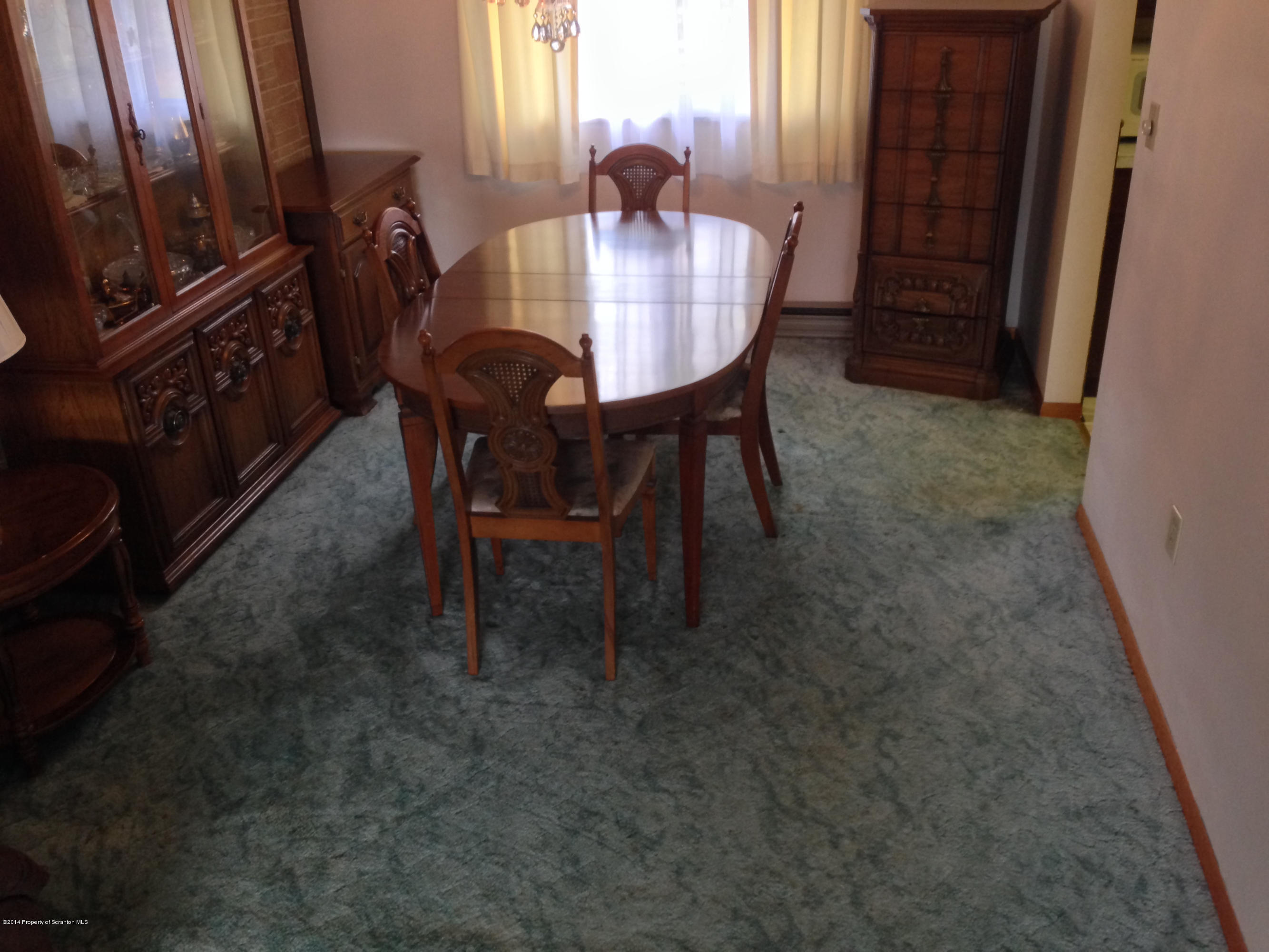 810 Lions Road Lake Ariel, PA 18436 - Photo 14 of 33 a view of a dining room with furniture and a chandelier