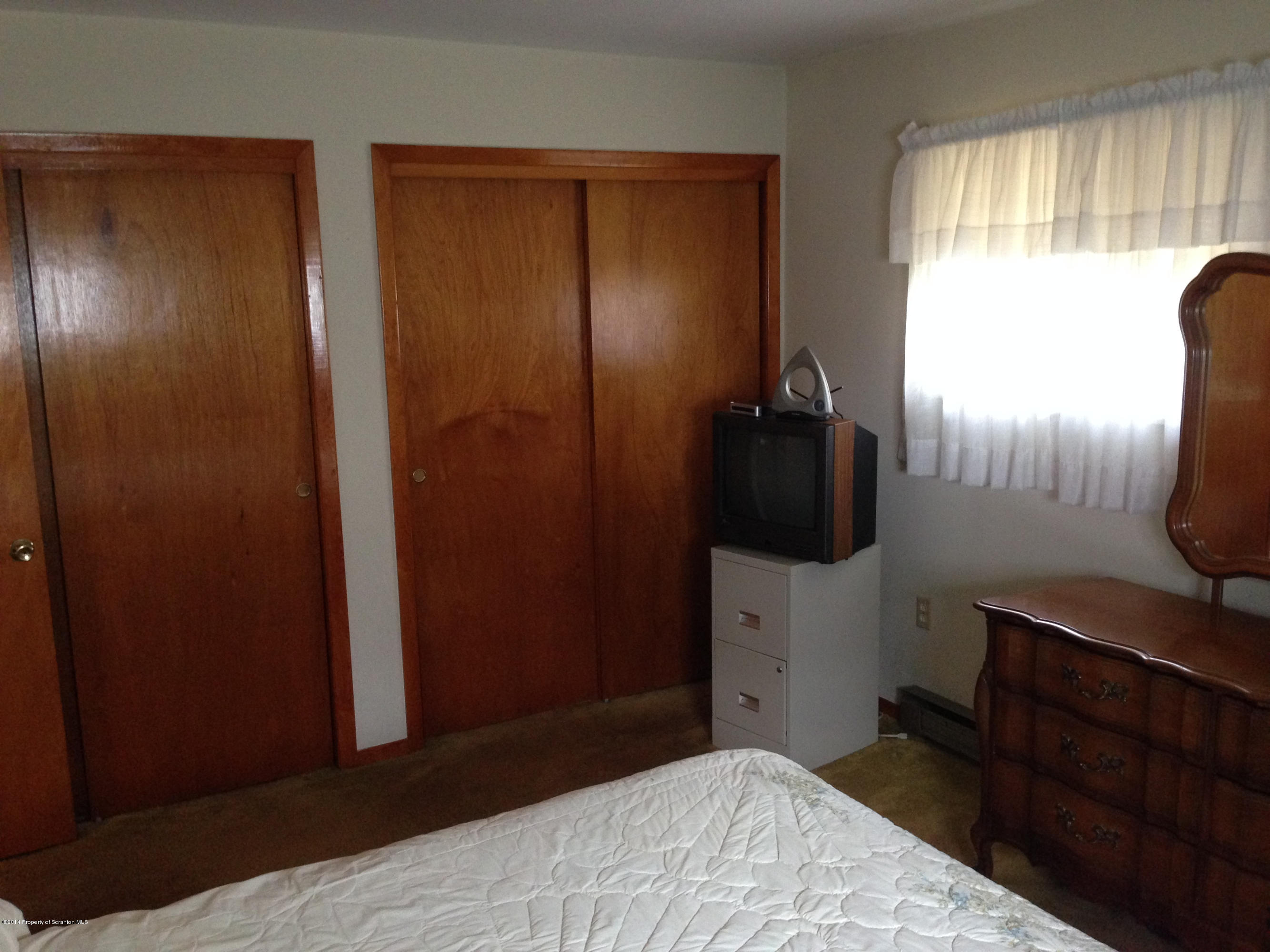810 Lions Road Lake Ariel, PA 18436 - Photo 23 of 33 a bedroom with a bed and a closet