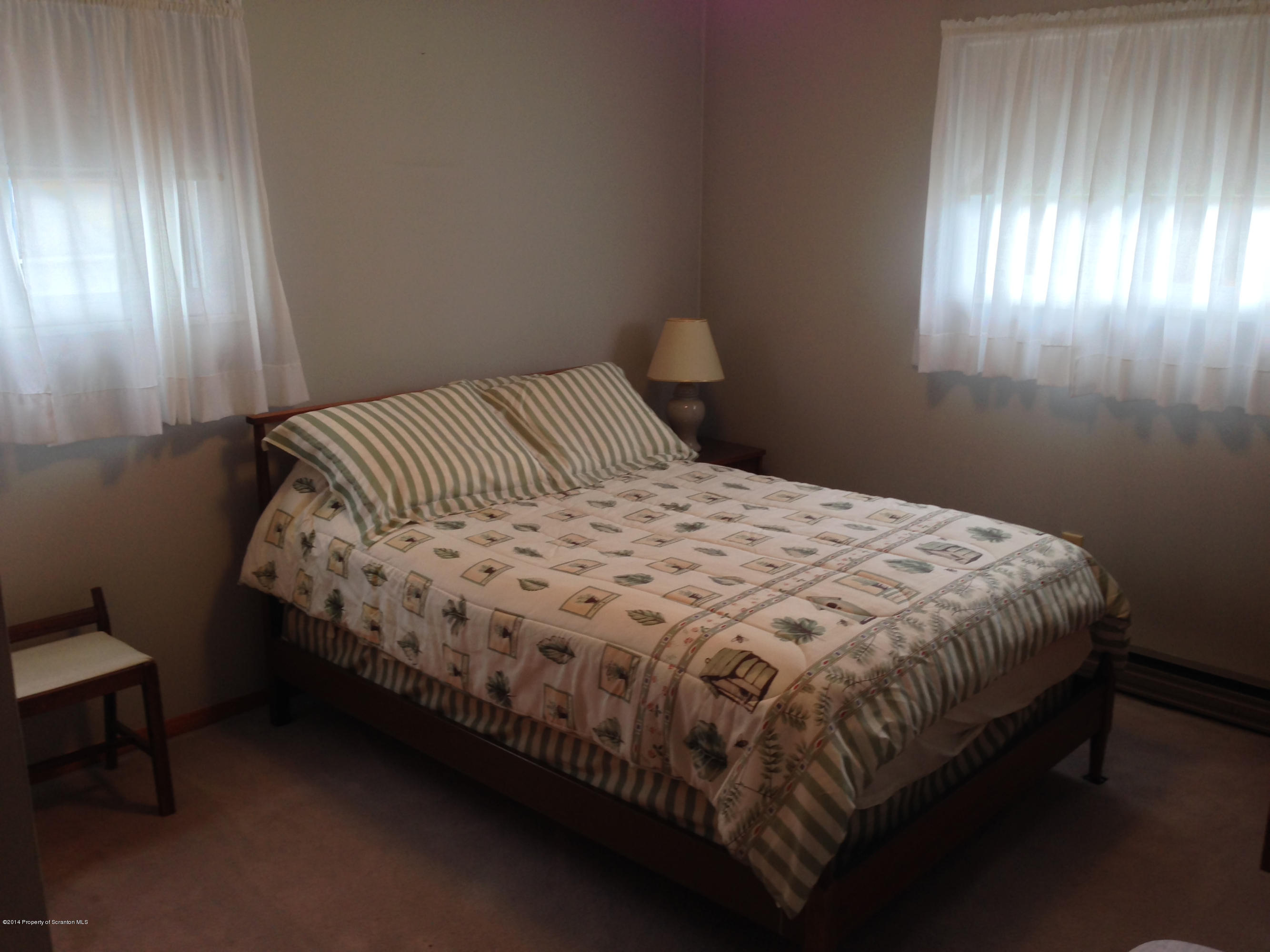 810 Lions Road Lake Ariel, PA 18436 - Photo 24 of 33 a bedroom with a bed and window