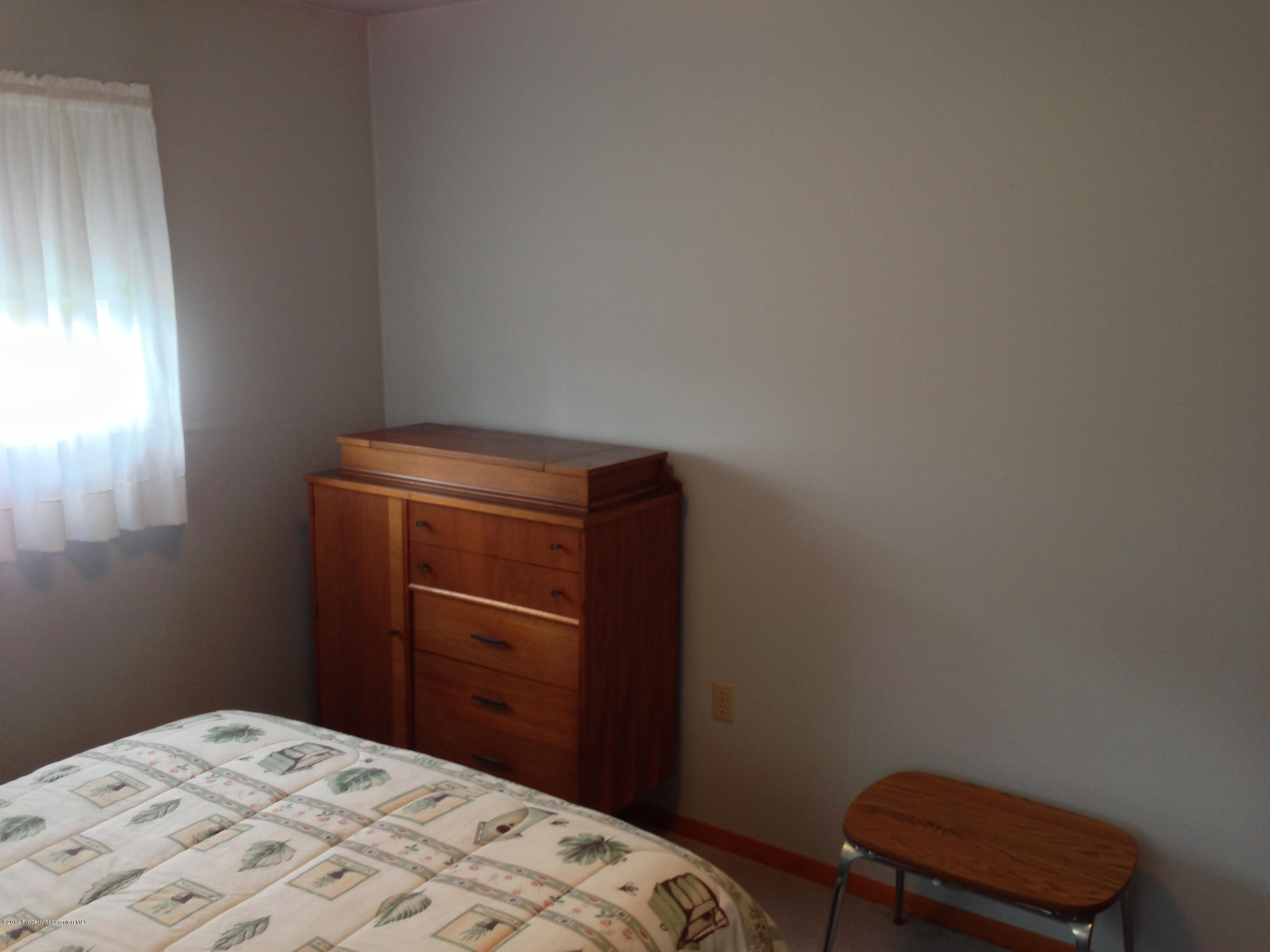 810 Lions Road Lake Ariel, PA 18436 - Photo 25 of 33 a bedroom with a bed and a closet