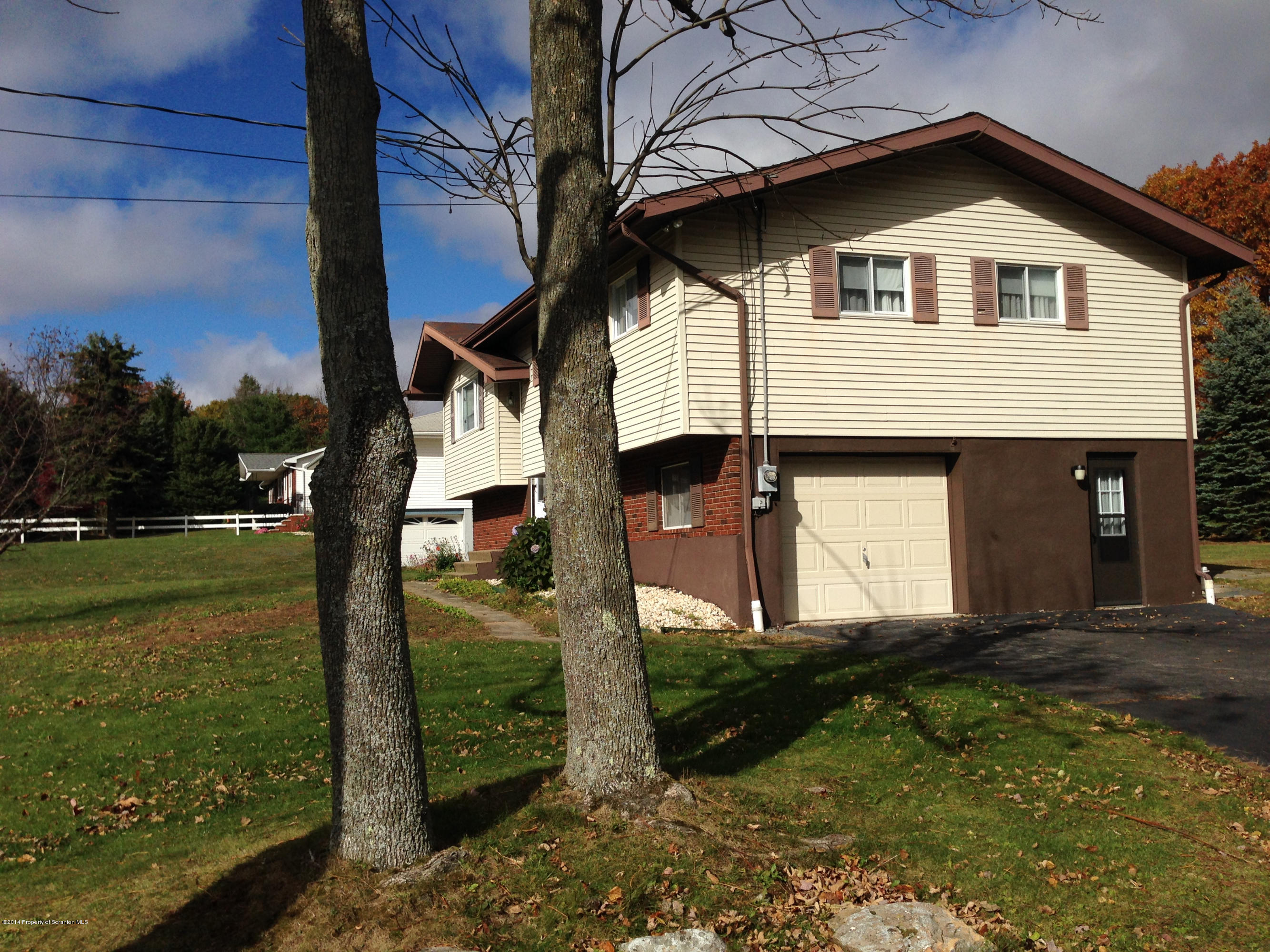 810 Lions Road Lake Ariel, PA 18436 - Photo 29 of 33 a front view of a house with garden