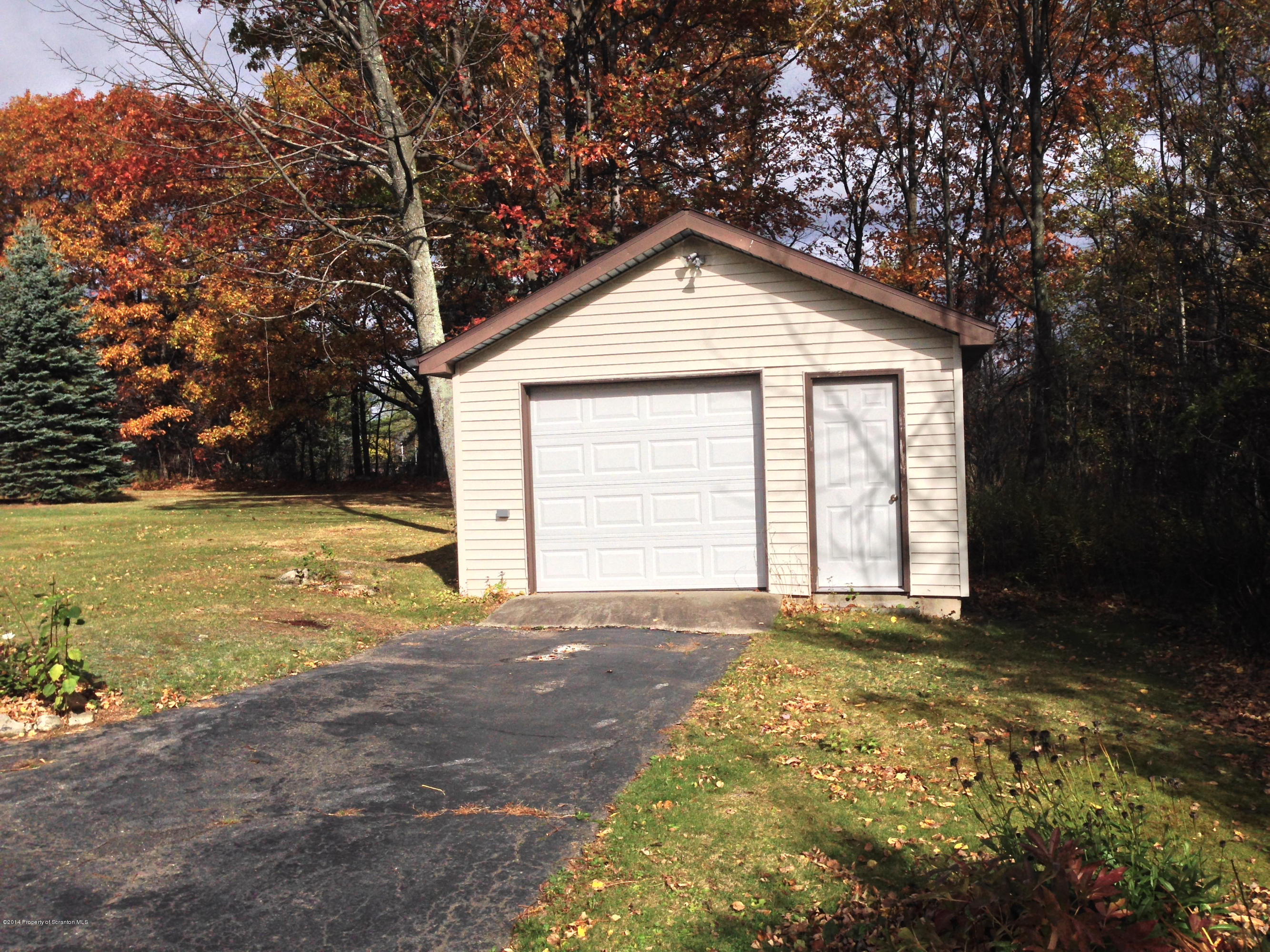 810 Lions Road Lake Ariel, PA 18436 - Photo 30 of 33 a view of an house with backyard and garden