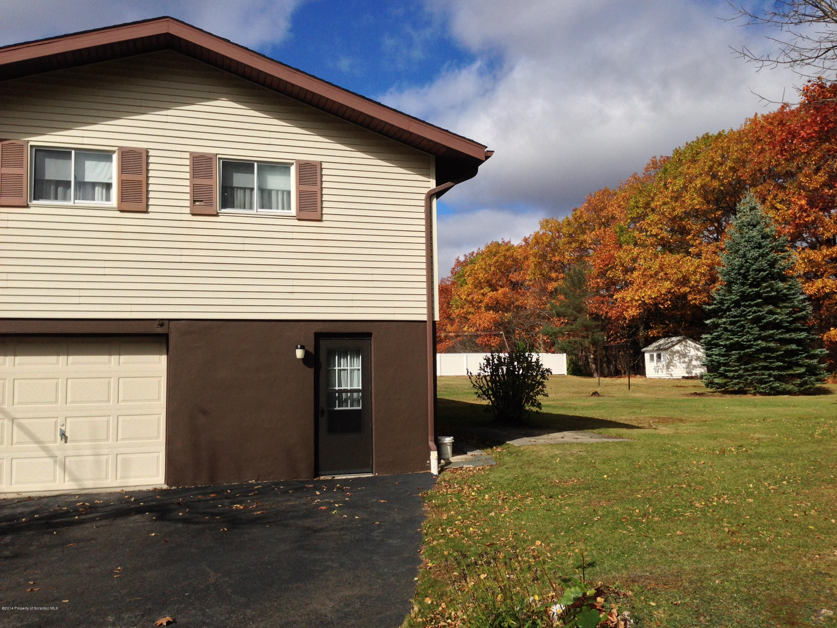 810 Lions Road Lake Ariel, PA 18436 - Photo 31 of 33 a front view of a house with a yard