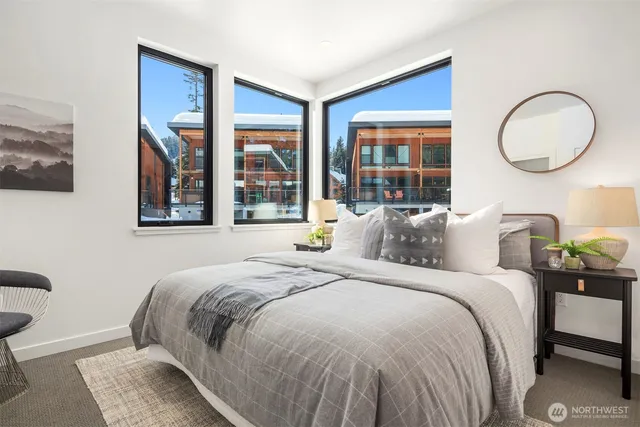 a bedroom with a large bed and a window