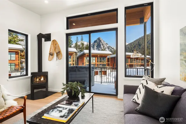 a living room with furniture large window and flat screen tv