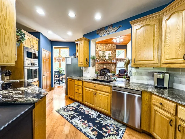 a view of walk in closet with clothes