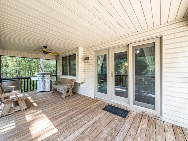 a bedroom with furniture and a flat screen tv