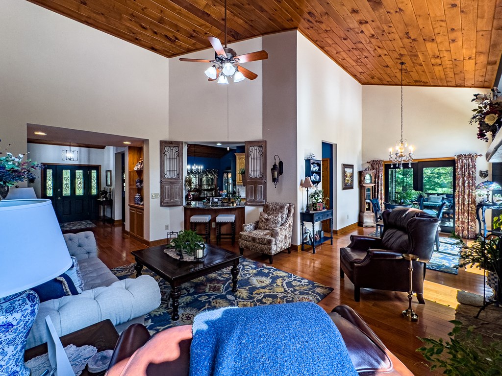 59 Cabin Run Lane Murphy, NC 28906 - Photo 29 of 82 a living room with furniture a rug and a chandelier
