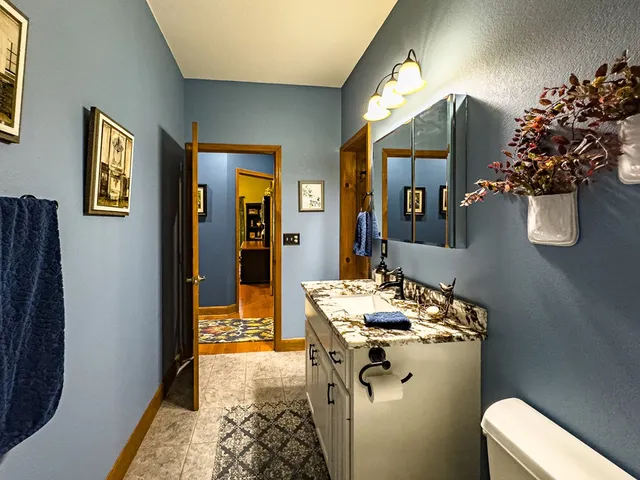 a kitchen with stainless steel appliances granite countertop a stove and a sink