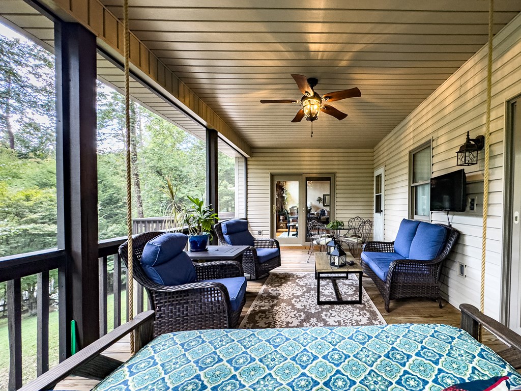 59 Cabin Run Lane Murphy, NC 28906 - Photo 49 of 82 a living room with furniture a fireplace and a table