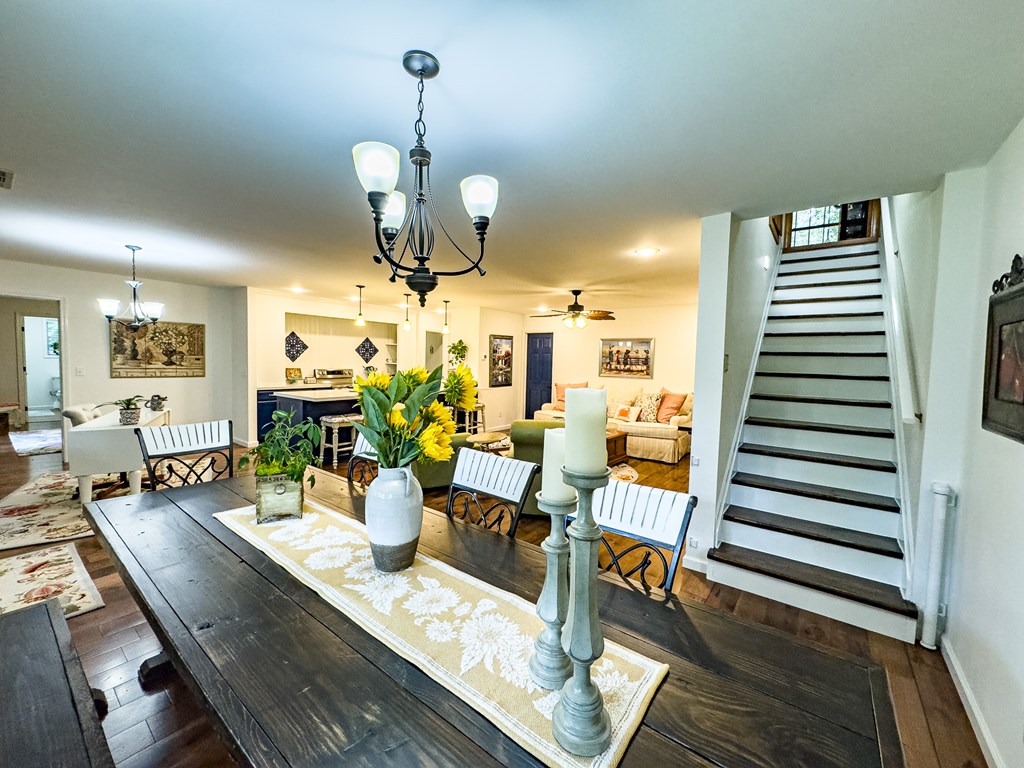 59 Cabin Run Lane Murphy, NC 28906 - Photo 52 of 82 a view of a dining room with furniture wooden floor and chandelier