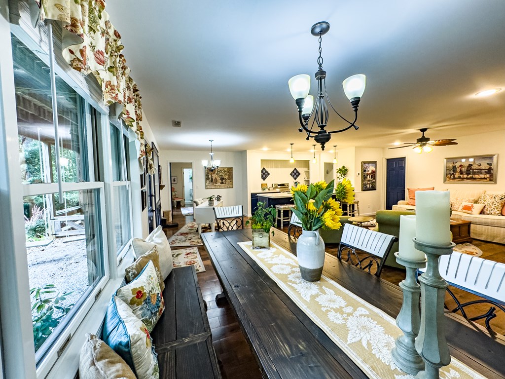 59 Cabin Run Lane Murphy, NC 28906 - Photo 53 of 82 a view of a dining room with furniture a chandelier and wooden floor