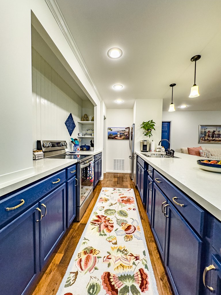 59 Cabin Run Lane Murphy, NC 28906 - Photo 58 of 82 a large kitchen with stainless steel appliances kitchen island granite countertop a sink and wooden cabinets