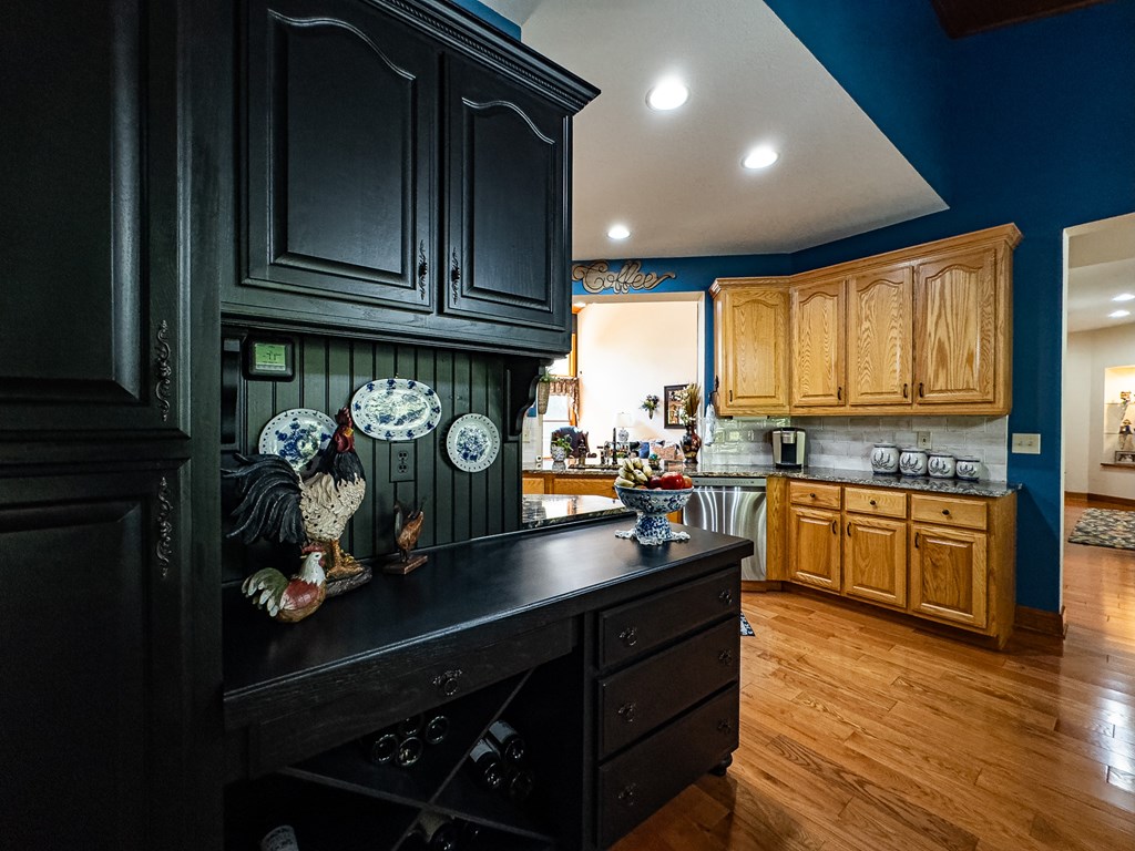 59 Cabin Run Lane Murphy, NC 28906 - Photo 10 of 82 a kitchen with granite countertop wooden cabinets and a stove top oven