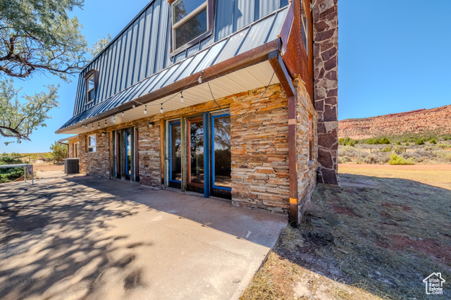 6178 East Zion Road Kanab, UT 84741 - Photo 42 of 48 Entrance to property with a metal roof and a patio area