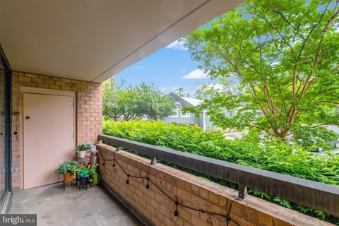 a view of a garden from a balcony