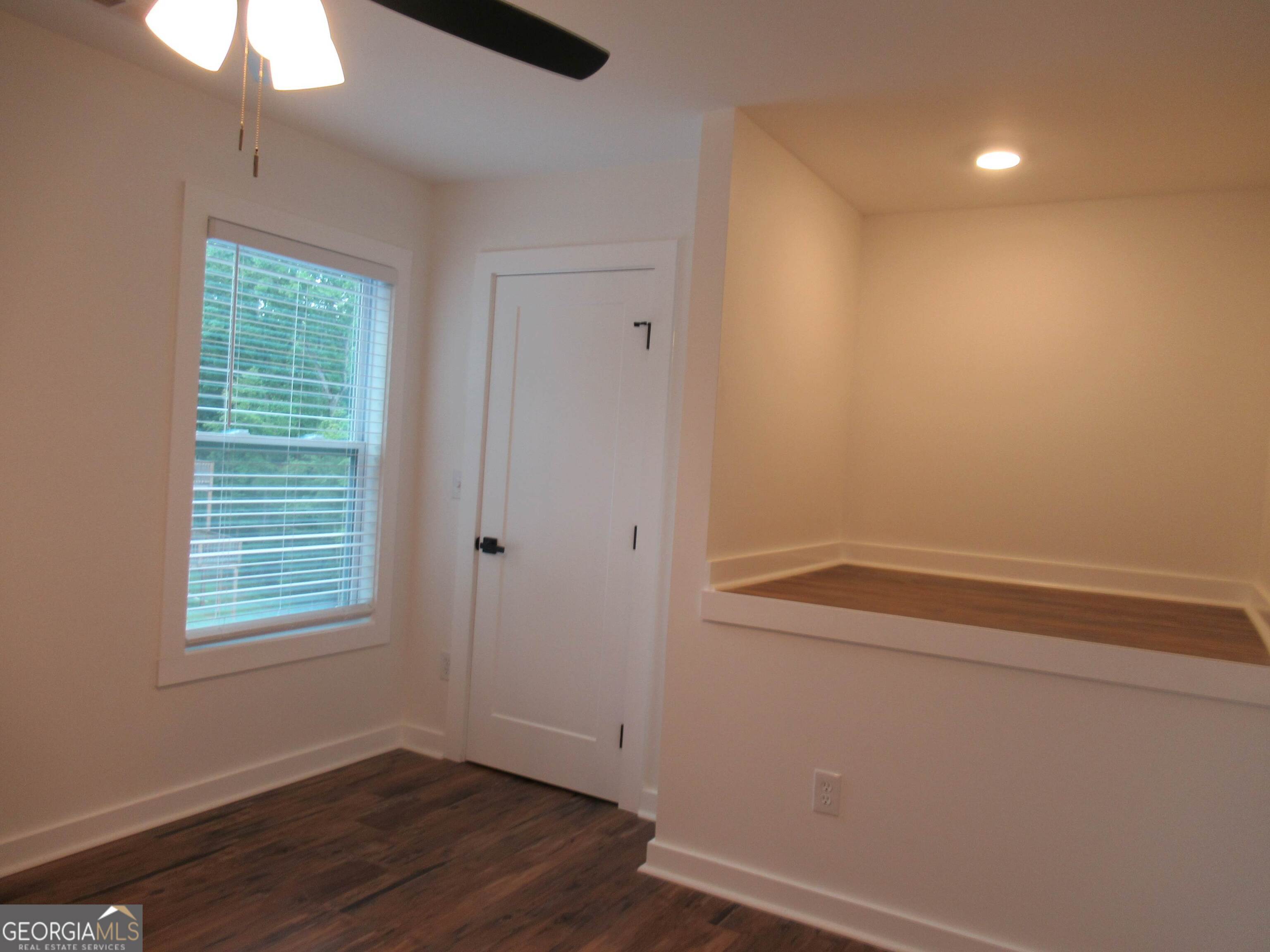 765 Old Kerns Road Dawsonville, GA 30534 - Photo 25 of 36 a view of room with hardwood floor and window