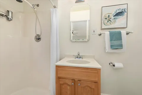 a bathroom with a sink and mirror
