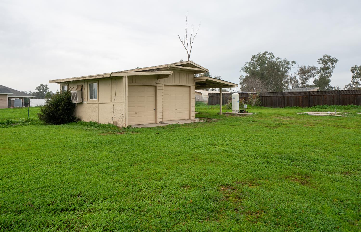 16026 Karen Road Madera, CA 93636 - Photo 11 of 38 a backyard of a house with lots of green space