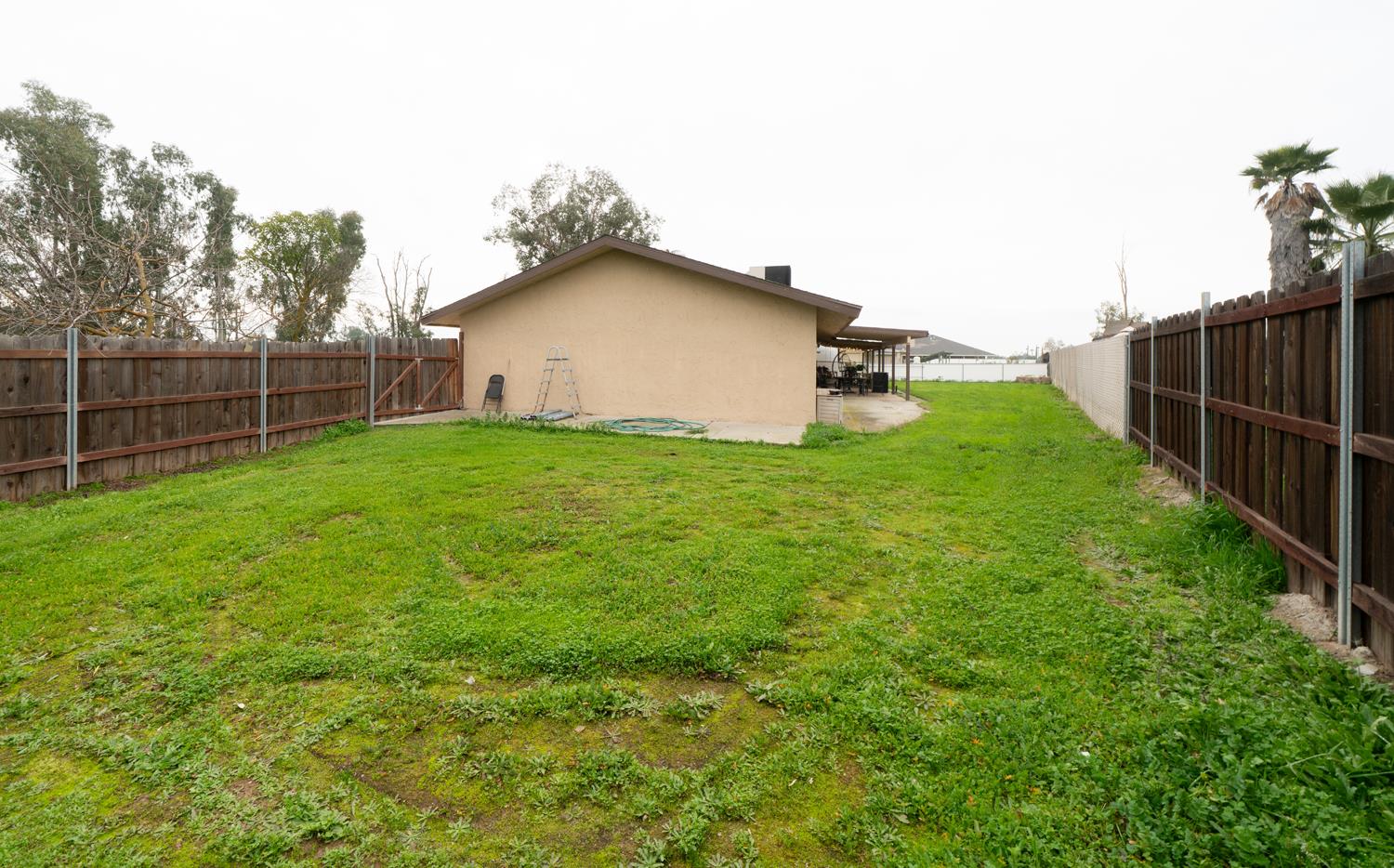 16026 Karen Road Madera, CA 93636 - Photo 15 of 38 a backyard of a house with lots of green space