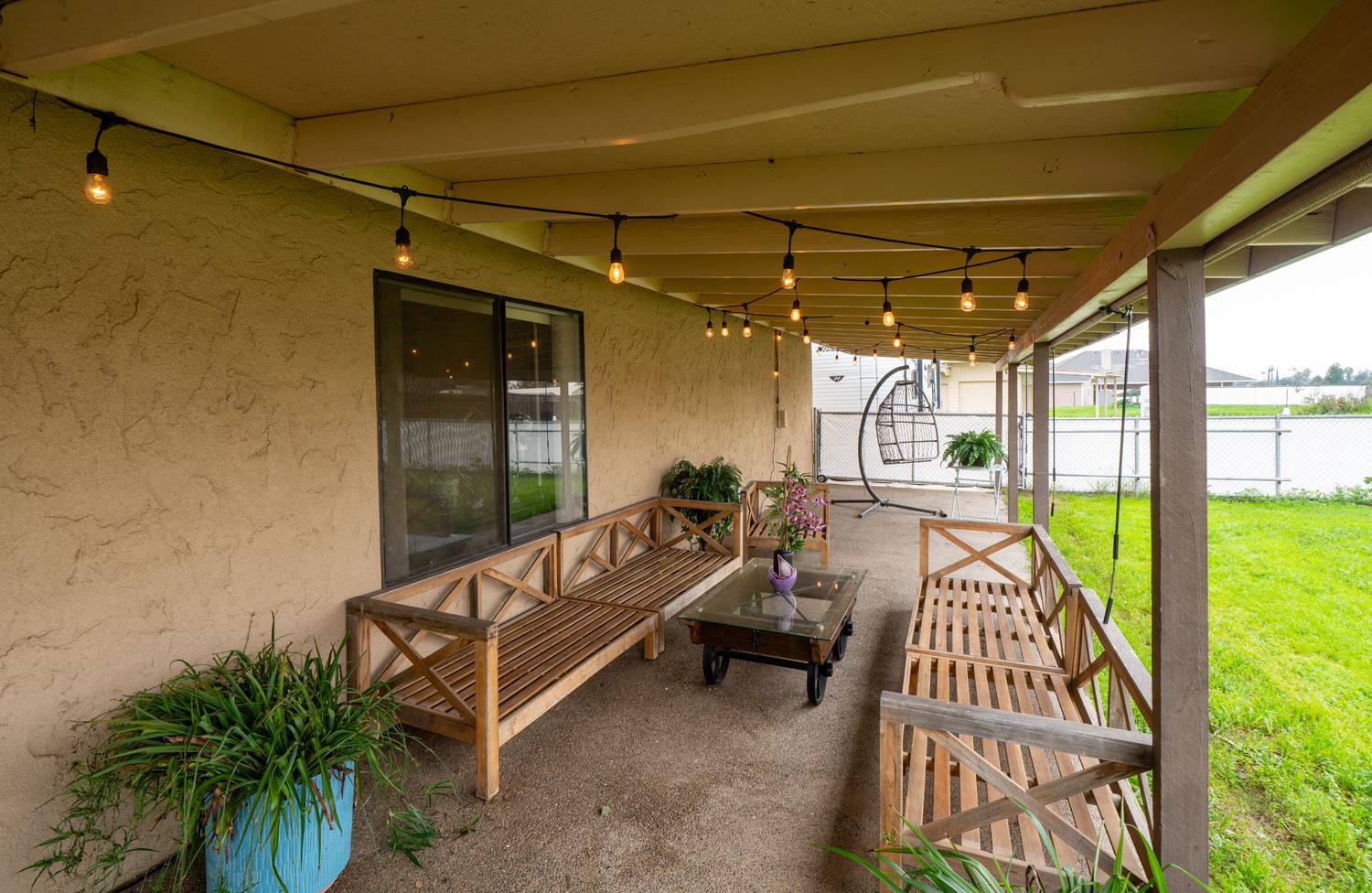 16026 Karen Road Madera, CA 93636 - Photo 18 of 38 a view of a patio with a table and chairs
