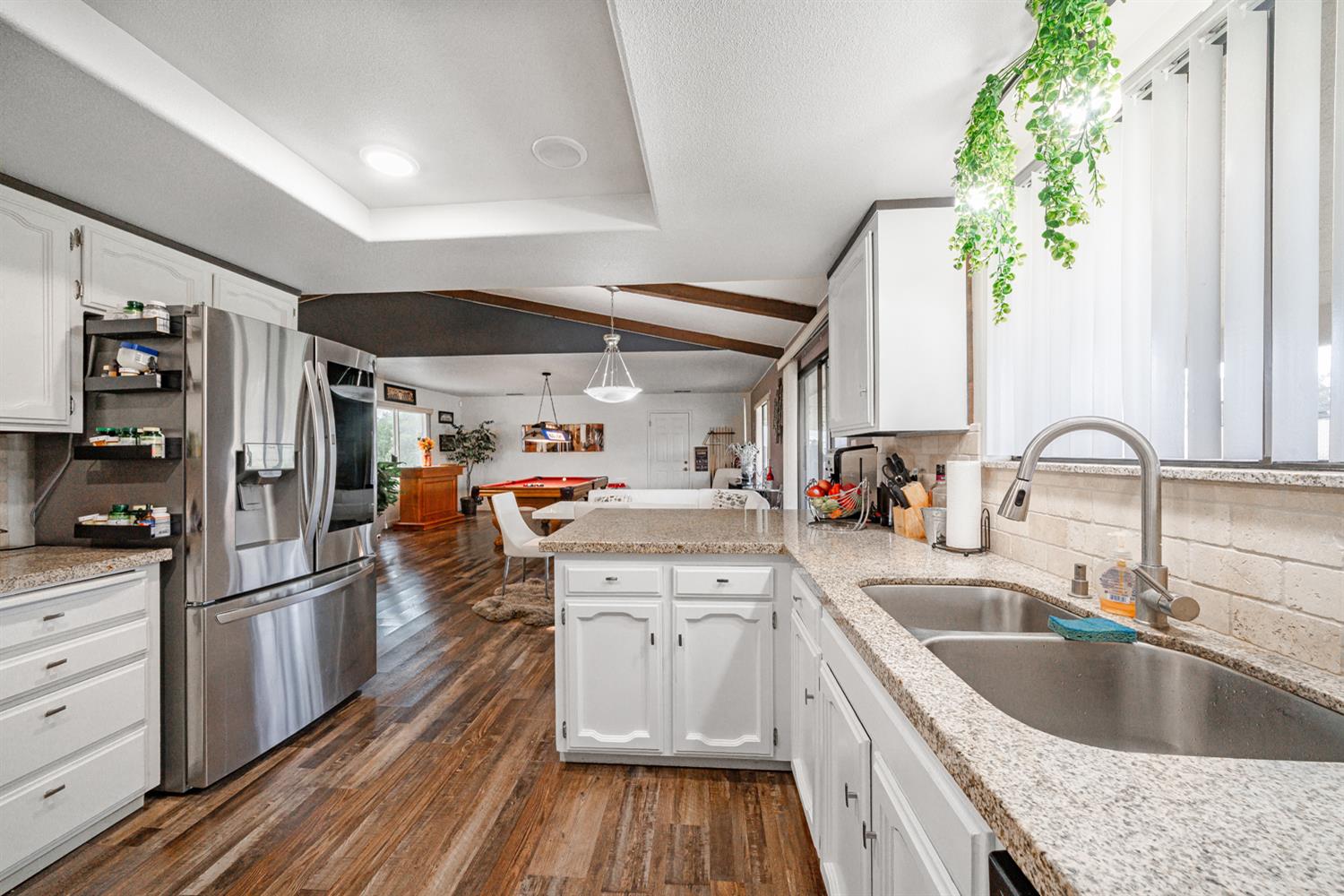 16026 Karen Road Madera, CA 93636 - Photo 28 of 38 a kitchen with granite countertop a sink stove and refrigerator