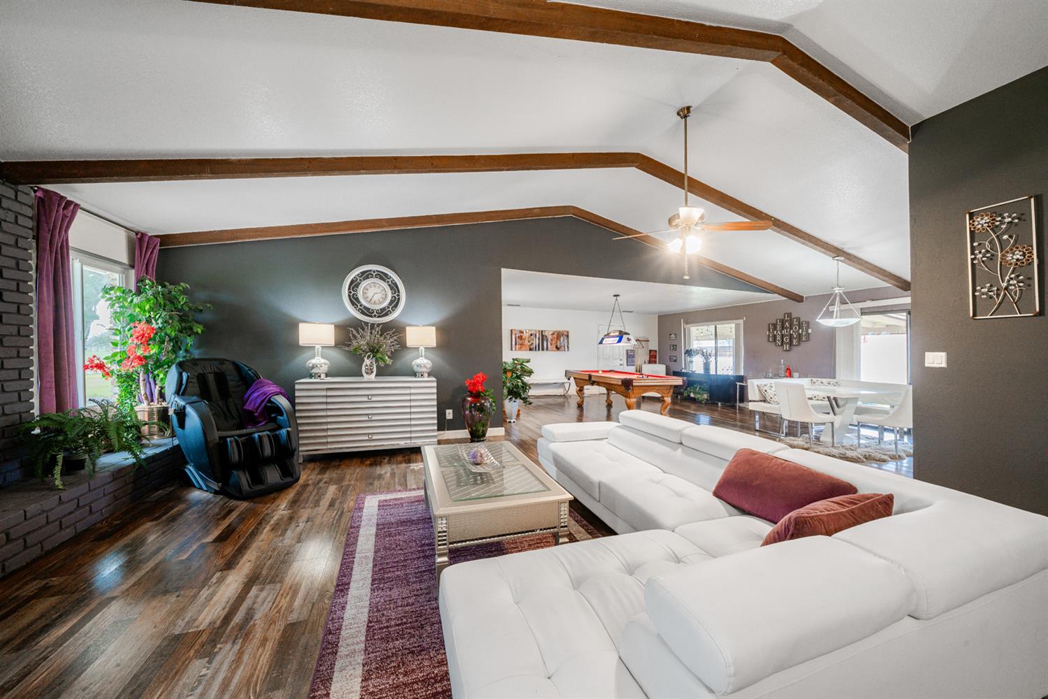16026 Karen Road Madera, CA 93636 - Photo 37 of 38 a living room with furniture and a potted plant