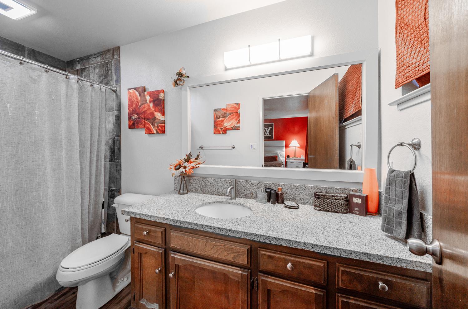 16026 Karen Road Madera, CA 93636 - Photo 4 of 38 a bathroom with a sink a toilet and a mirror