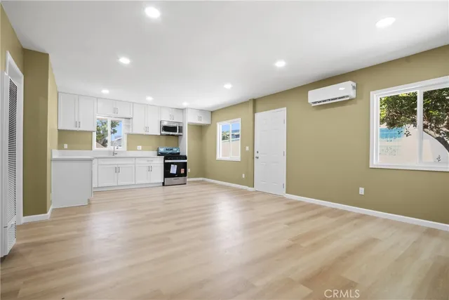 a view of kitchen with wooden floor