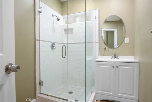 a bathroom with a mirror a sink and a mirror