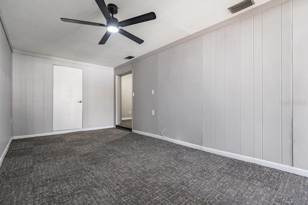 2709 West Abdella Street Tampa, FL 33607 - Photo 15 of 29 an empty room with closet and fan