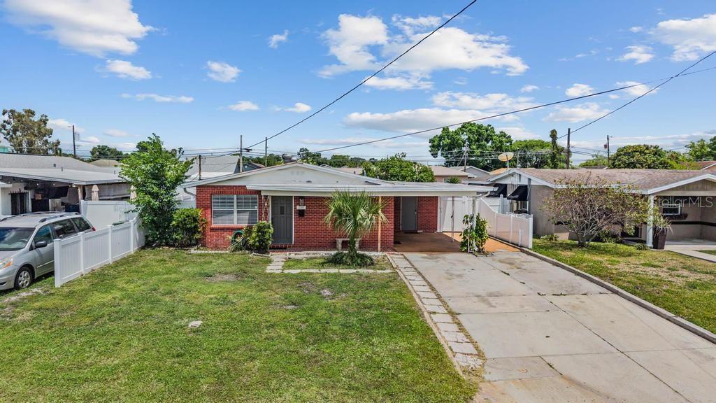 2709 West Abdella Street Tampa, FL 33607 - Photo 2 of 29 a view of a house with a yard